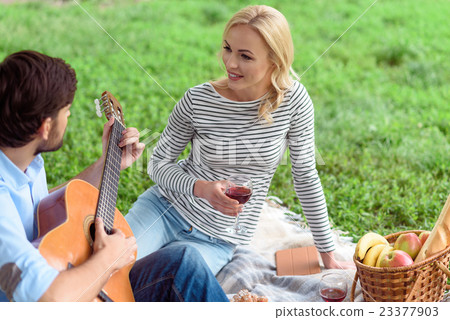 Carefree lovers relaxing in park Carefree lovers relaxing in park 23377903