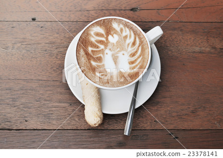 latte art coffee with two birds pattern and cookie 23378141