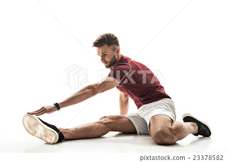 Happy male athlete doing exercise 23378582