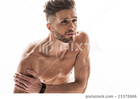 Young male athlete feels pain in shoulder Young male athlete feels pain in shoulder 23378866