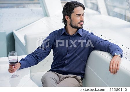 Attractive mab resting with alcohol drink Attractive mab resting with alcohol drink 23380140