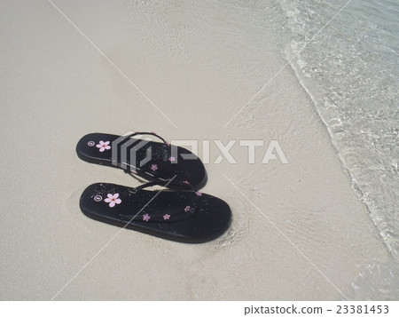 Sandy beach and beach sandals 23381453