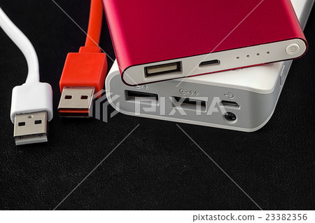 Red and white power bank with usb cable Red and white power bank with usb cable 23382356