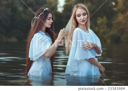 Woman doing hairstyle girlfriend. Woman doing hairstyle girlfriend. 23383984