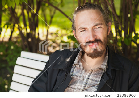 Outdoor portrait of young bearded Asian man Outdoor portrait of young bearded Asian man 23385906
