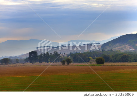 Italy. Green fields and mountains in morning fog. Italy. Green fields and mountains in morning fog. 23386009