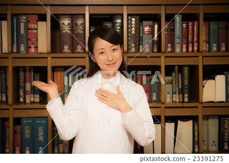 Woman in library white garment Woman in library white garment 23391275
