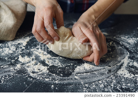 hands and dough 23391490