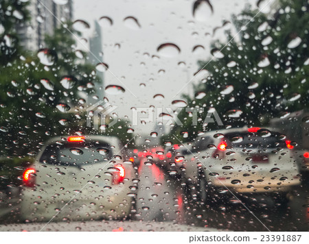Driving in the rain, view through windshield. Driving in the rain, view through windshield. 23391887
