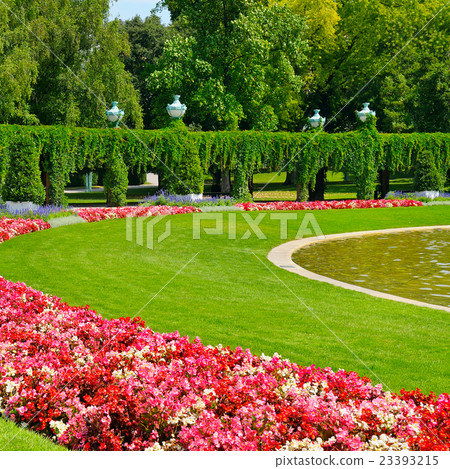 summer park with flower bed and green lawn summer park with flower bed and green lawn 23393215