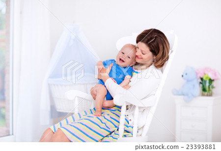 Mother and baby in white bedroom Mother and baby in white bedroom 23393881