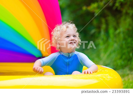 Happy baby playing in swimming pool Happy baby playing in swimming pool 23393891