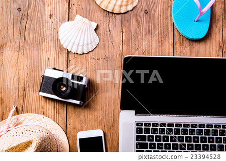 Summer vacation composition. Laptop, camera, hat Summer vacation composition. Laptop, camera, hat 23394528