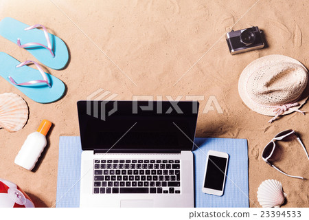 Summer vacation composition. Sandals, hat, laptop Summer vacation composition. Sandals, hat, laptop 23394533