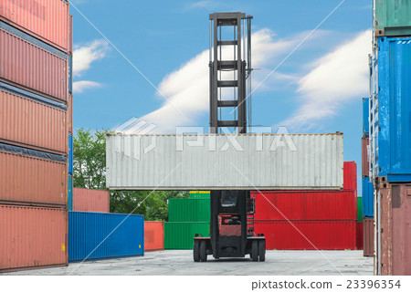 Forklift handling container box loading to depot 23396354