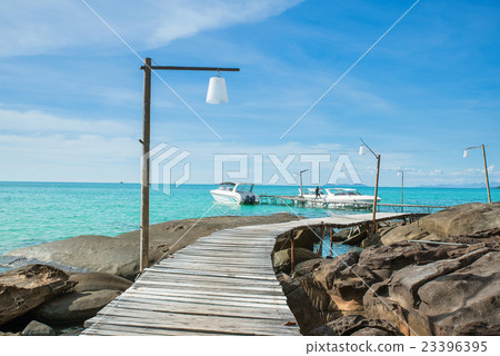 Wooded bridge in harbour against blue sky 23396395