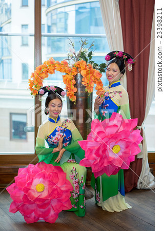 two chinese girls in traditional style clothes two chinese girls in traditional style clothes 23398211