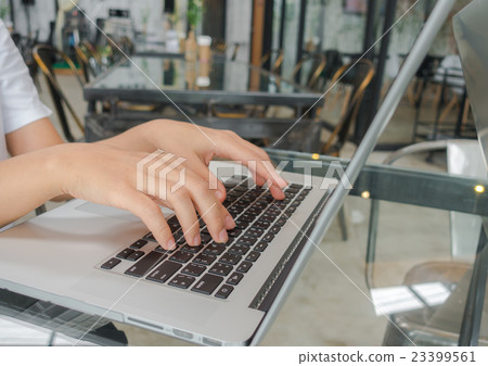 Closeup of business woman hand typing on laptop keyboard . 23399561