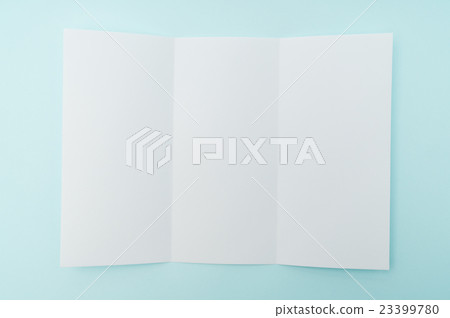 Trifold white template paper on blue background . 23399780