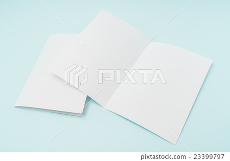Bifold white template paper on blue background . 23399797