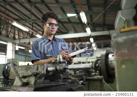 worker take note for check machine. 23400131