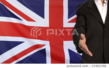 Open hand and Great Britain flag in the background 23402496