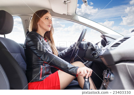 Young woman driving car. Fast delivery background 23403330