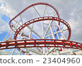 a steel roller coaster on cloudy 23404960