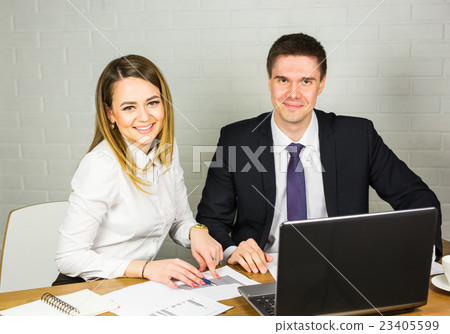 Male and female office workers. 23405599