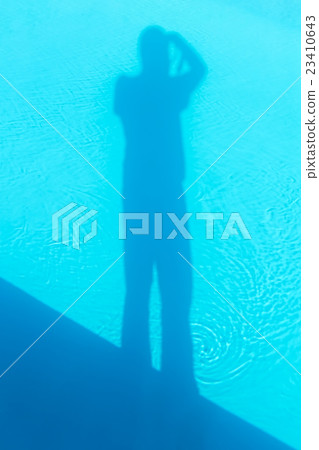 Shadow of photographer in the swimming pool Shadow of photographer in the swimming pool 23410643