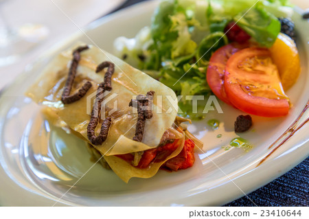 Mille-feuille escalivada with anchovy in the restaurant from Sp Mille-feuille escalivada with anchovy in the restaurant from Sp 23410644