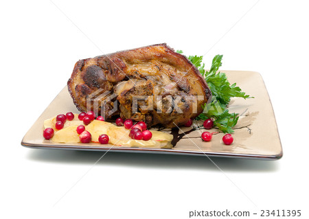 roast pork knuckle with apples and cranberries 23411395
