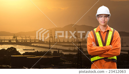engineer with shipping port in sunset time 23412063