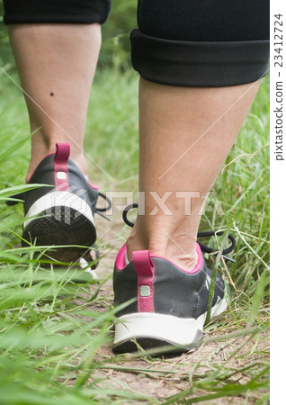 retail of woman walking with sport shoes retail of woman walking with sport shoes 23412724