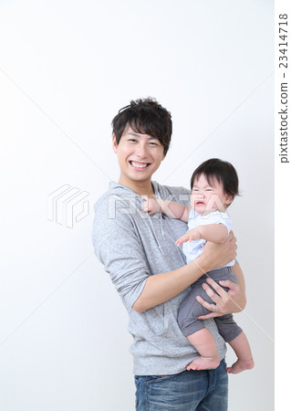 Dad holding a child 23414718