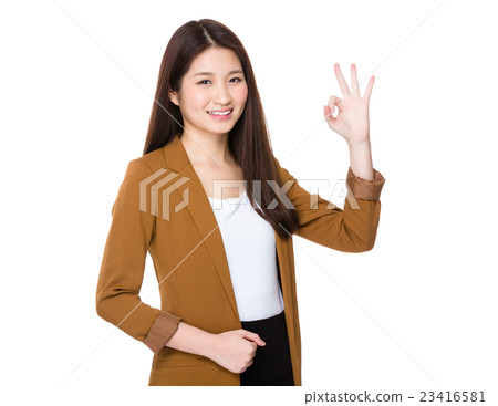 Asian young businesswoman with ok sign gesture Asian young businesswoman with ok sign gesture 23416581