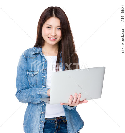 Asian woman use of the notebook computer Asian woman use of the notebook computer 23416685