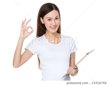 Asian Young Woman hold with clipboard and ok sign gesture 23416748