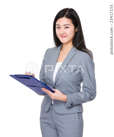 Businesswoman take note on clipboard Businesswoman take note on clipboard 23417155