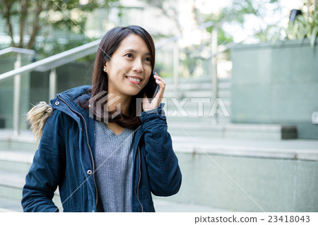 Woman talk to cellphone at outdoor 23418043