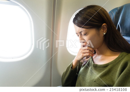 Fear of flying woman in plane airsick 23418108
