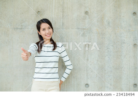 Asian woman showing thumb up 23418494