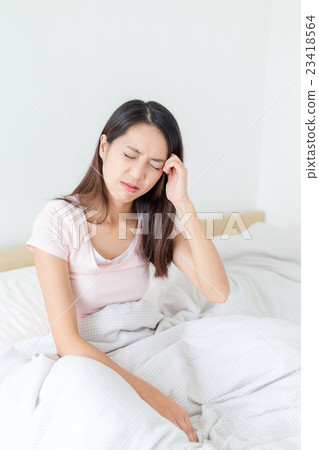 Woman feeling headache 23418564