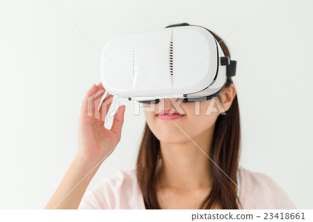Woman experienc though vr device 23418661