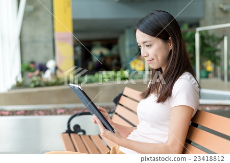 Woman use of tablet pc Woman use of tablet pc 23418812