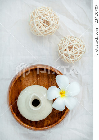 Frangipani flowers with herbal spa products . Frangipani flowers with herbal spa products . 23420707