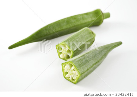 Okra cut in half beside it - Stock Photo [23422415] - PIXTA