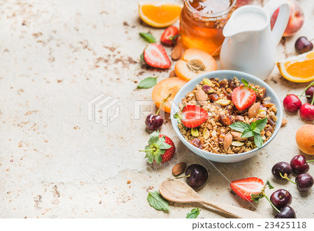 Healthy breakfast ingredients. Bowl of oat granola Healthy breakfast ingredients. Bowl of oat granola 23425118