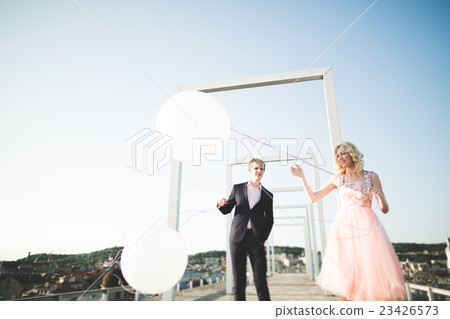 Lovers man and woman embracing each other outdoors Lovers man and woman embracing each other outdoors 23426573