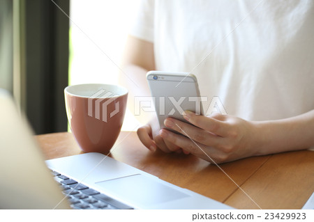 Business woman watching smaho Business woman watching smaho 23429923